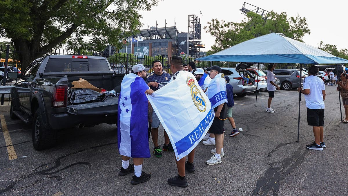 Real Madrid fans tailgating in a parking lot in Philadelphia