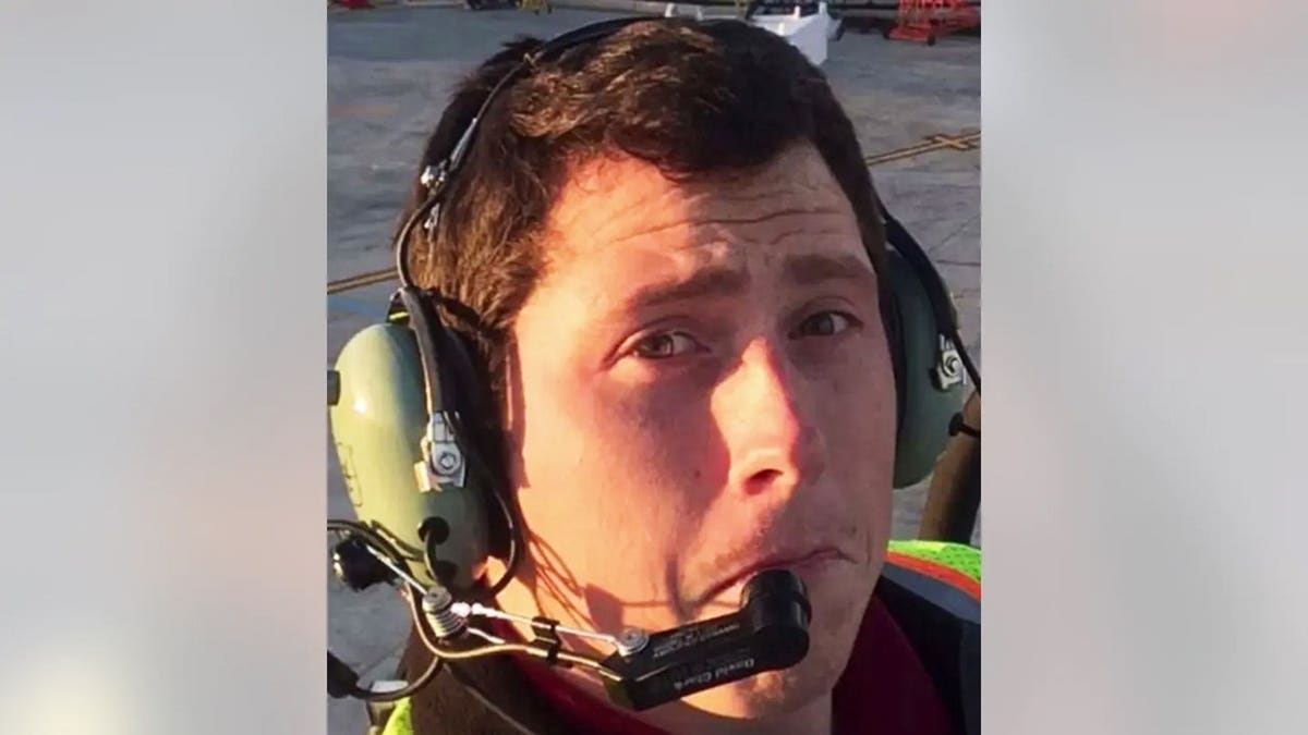 Richard Russell making a funny face while taking a selfie at the airport.