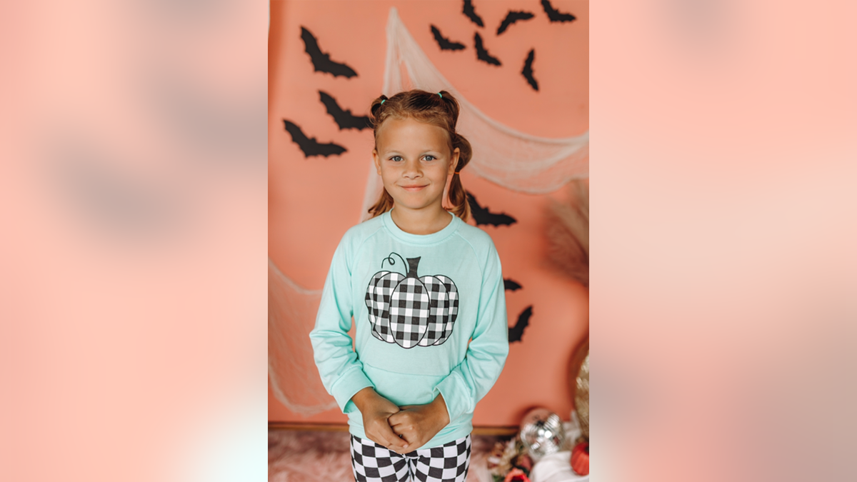 Athena Strand smiling in a Halloween costume