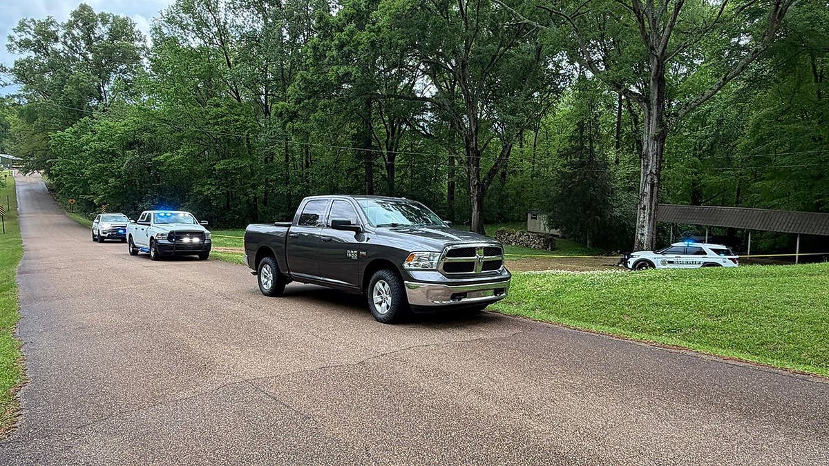 Law enforcement outside Lana Bradley's home, April 4, in Mississippi.