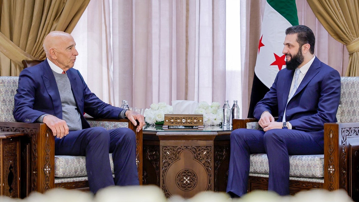 Syrian President Ahmed Sharaa and U.S. Special Envoy Thomas Barrack seated during a meeting in Damascus