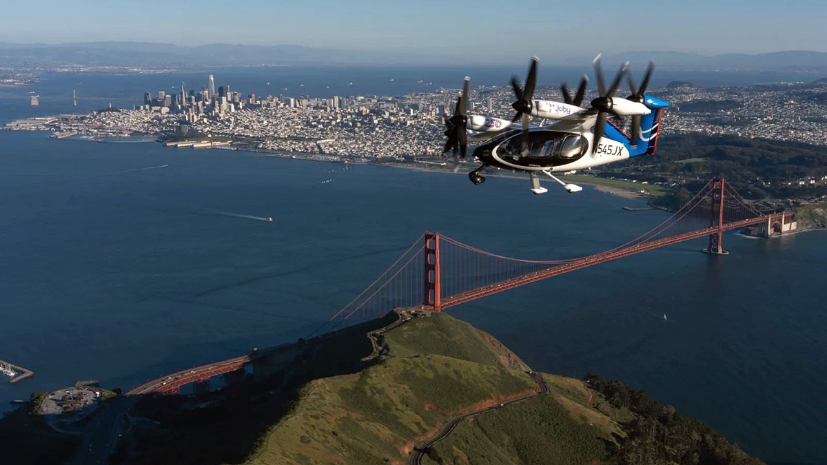 Joby air taxi flying over the Golden Gate Bridge in San Francisco