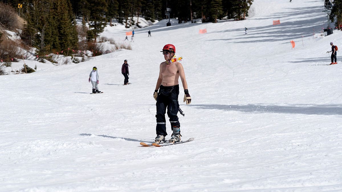 A man skiing shirtless at Arapahoe Basin Ski Resort in Colorado