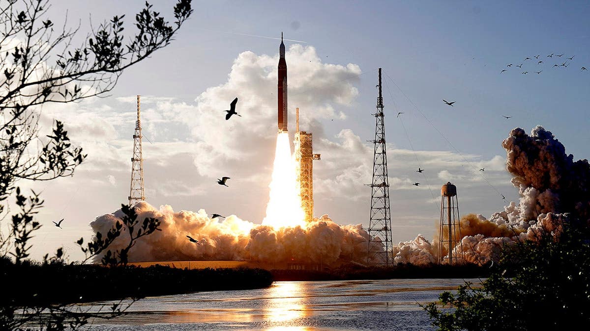NASA's Artemis II moon rocket lifting off from Kennedy Space Center launch pad
