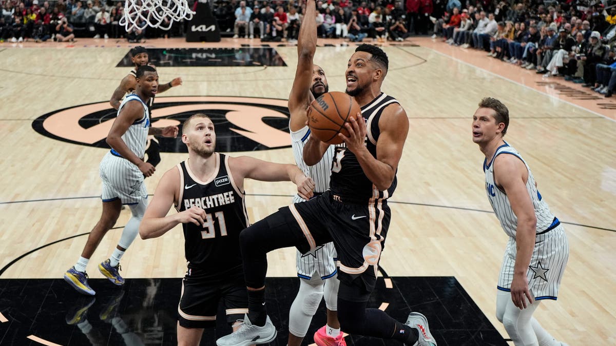 Atlanta Hawks guard CJ McCollum shooting basketball against Orlando Magic