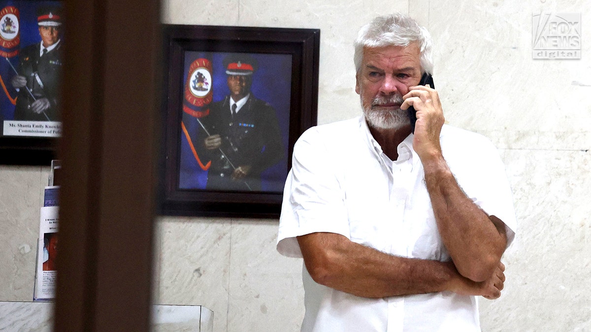 Brian Hooker leaves police station in The Bahamas, with lawyer