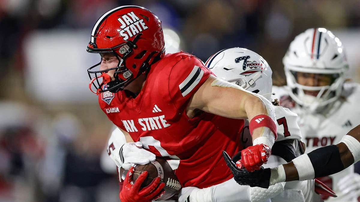 Brock Rechsteiner tackled by Jordan Stringer during football game in Montgomery Alabama