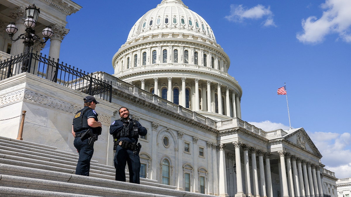 Capitol police officers chat on the steps of the Capitol in Washington, D.C.