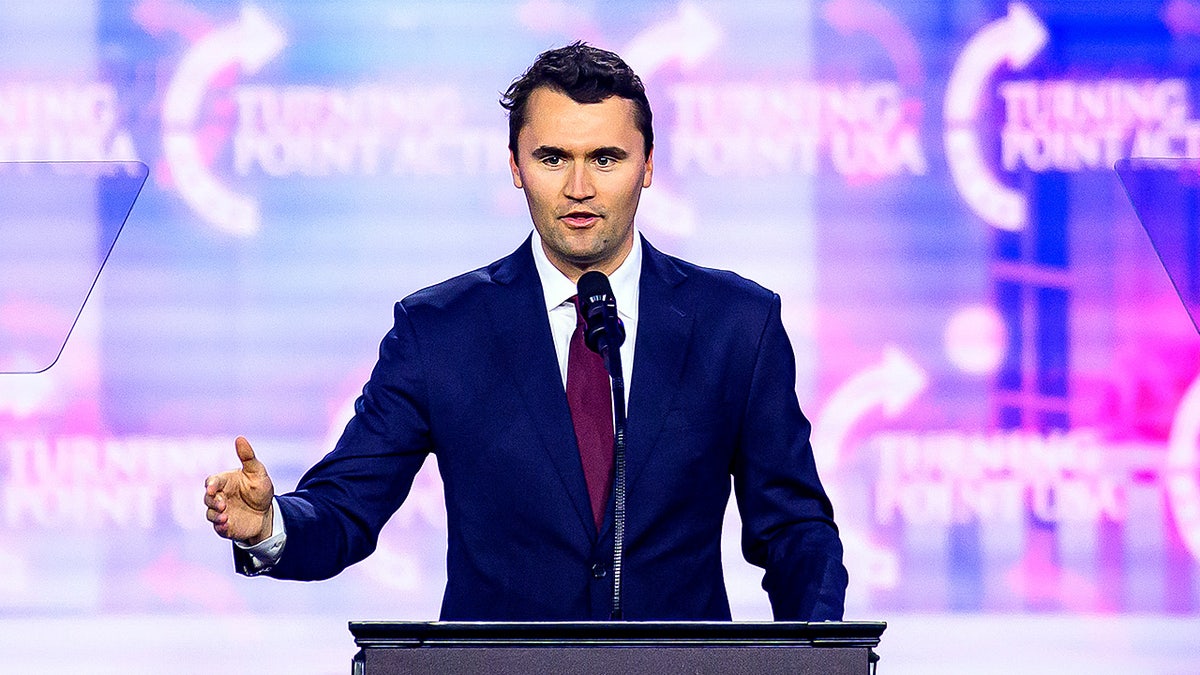 Charlie Kirk speaking onstage at AmericaFest 2024 in Phoenix, Arizona