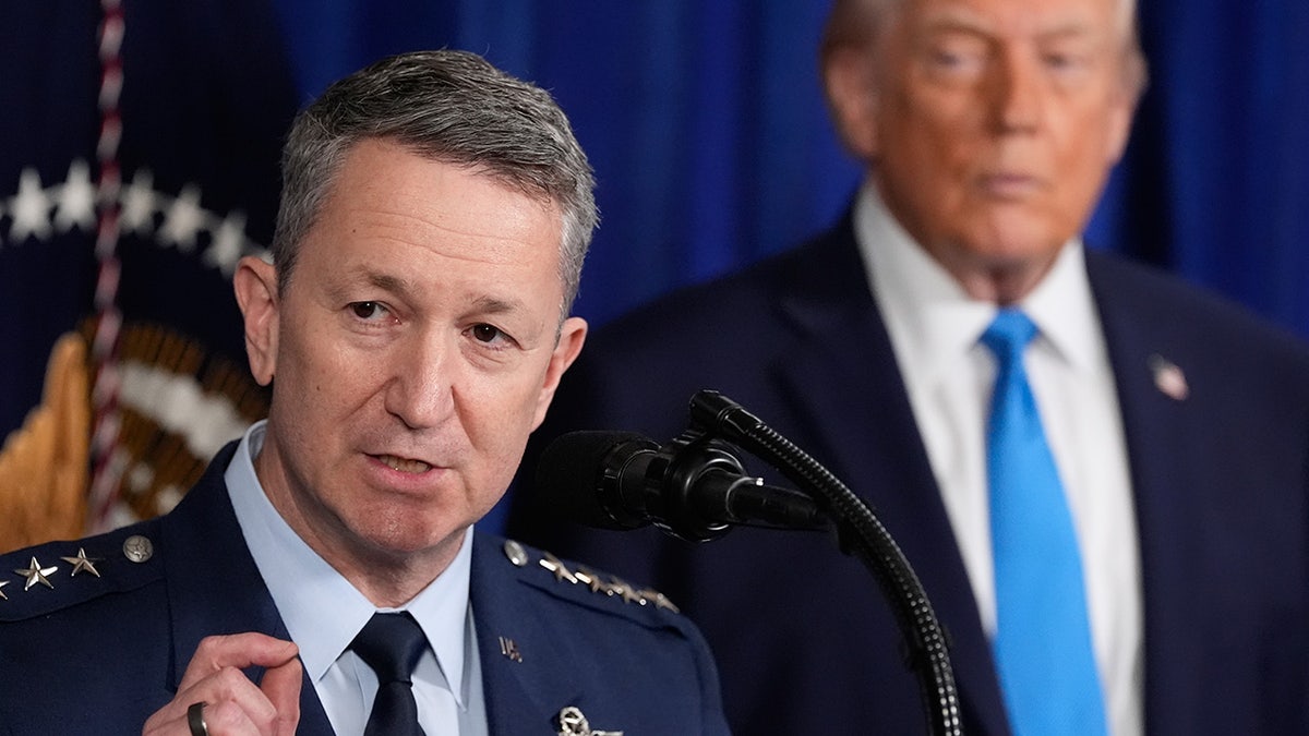 President Donald Trump listening to Joint Chiefs of Staff Gen. Dan Caine speaking at Mar-a-Lago