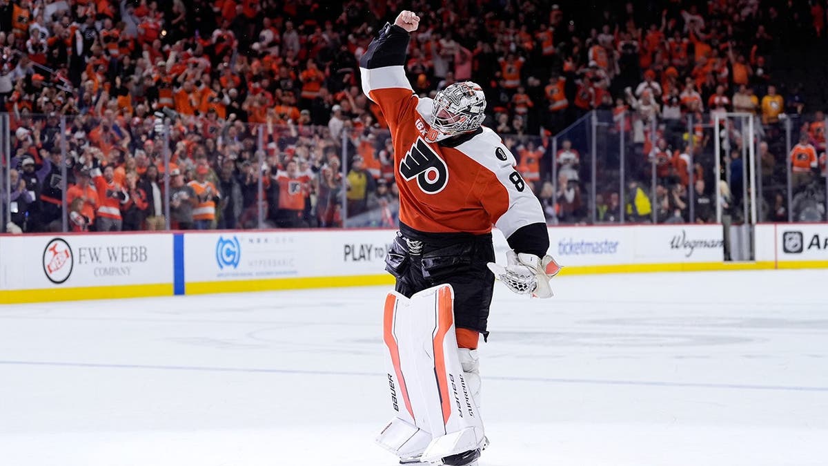 Philadelphia Flyers goalie Dan Vladar celebrating on ice