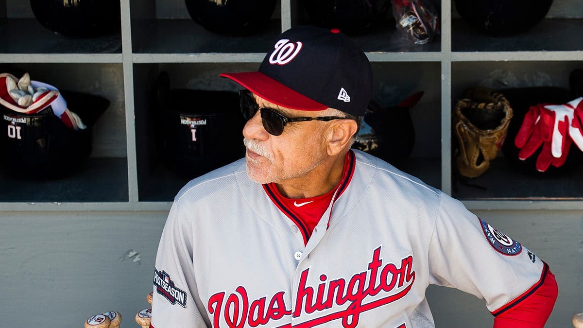 Davey Lopes standing in the dugout at Dodger Stadium