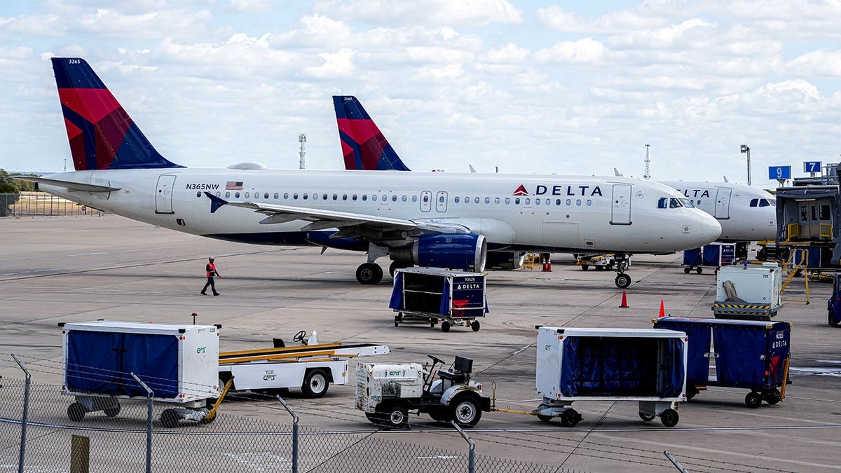 A Delta Air Lines plane taxiing to the terminal at Austin-Bergstrom International Airport.