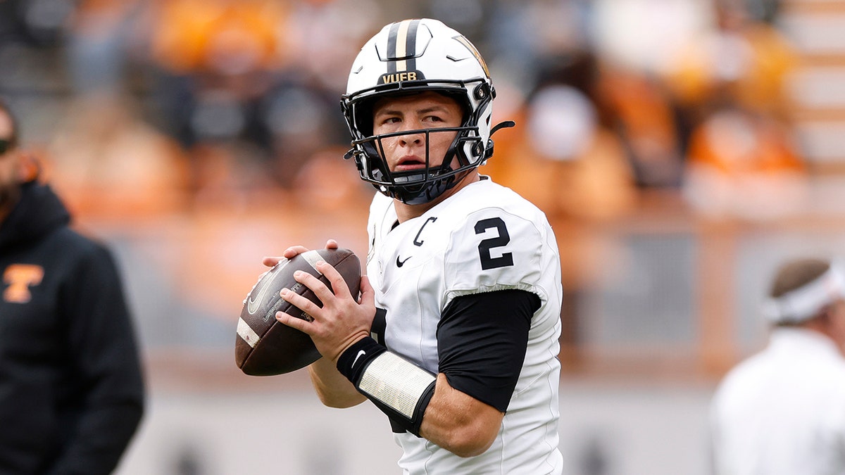 Diego Pavia of Vanderbilt Commodores warming up on football field at Neyland Stadium