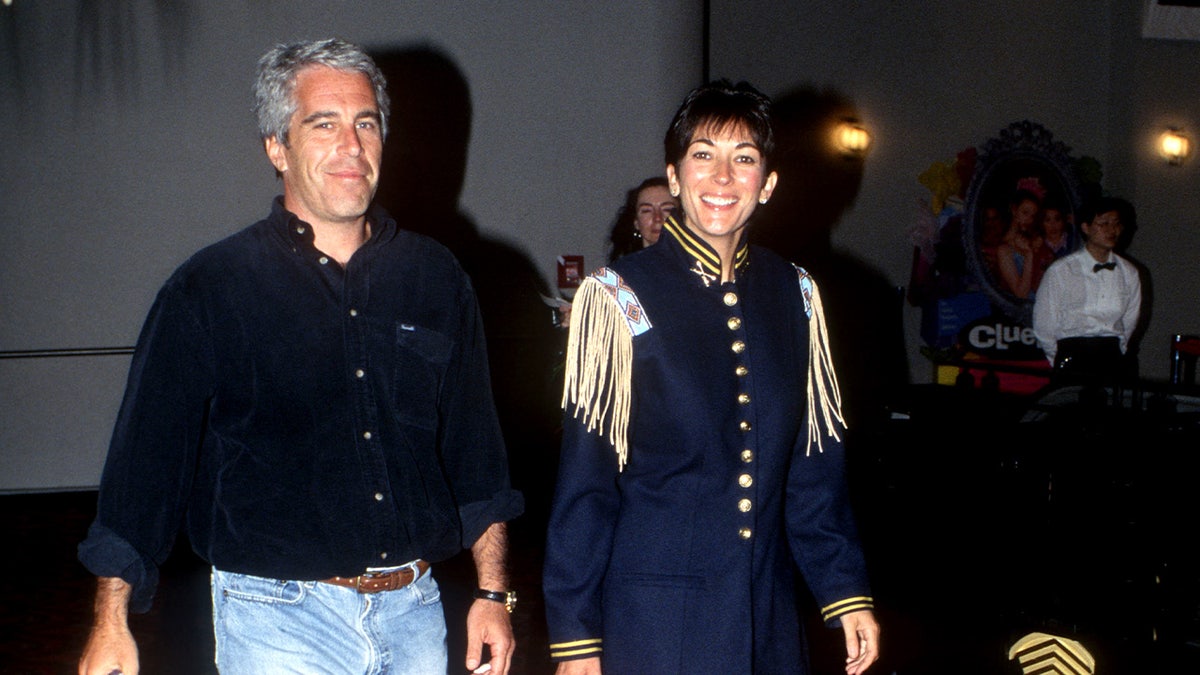 Jeffrey Epstein and Ghislaine Maxwell posing at Batman Forever event in New York City