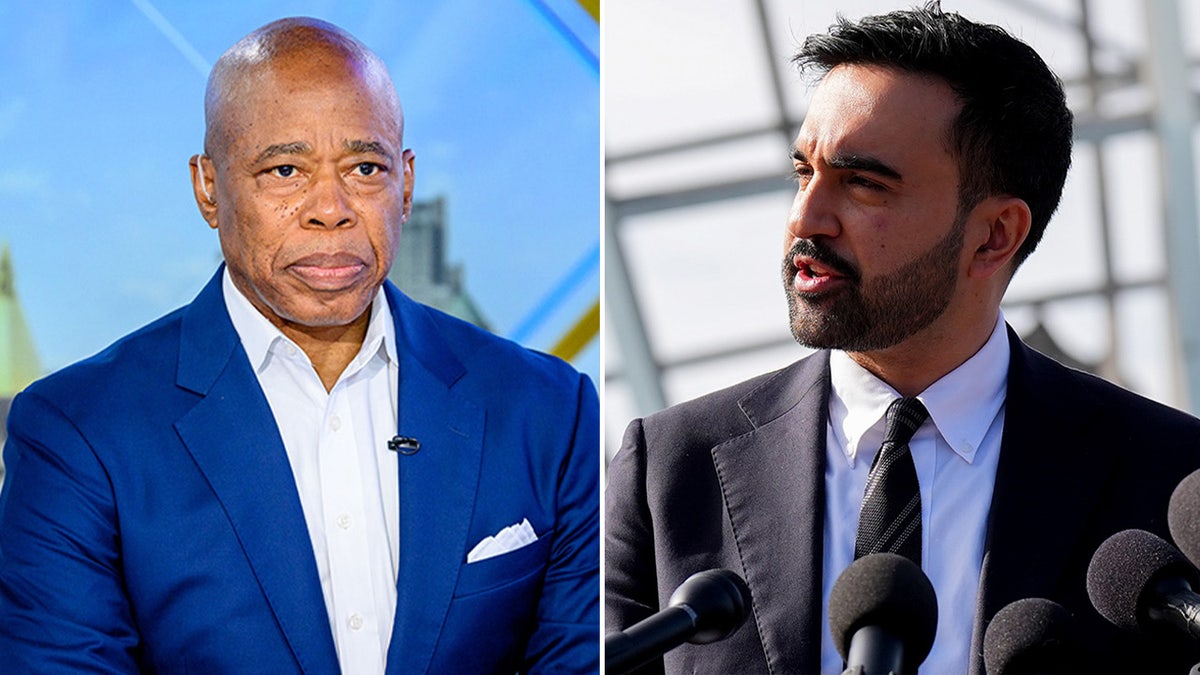 NYC Mayor Eric Adams and mayor-elect Zohran Mamdani standing together