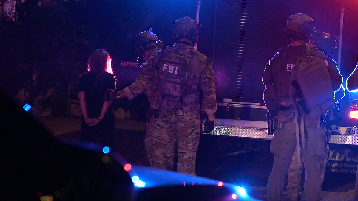 FBI agents gather during nighttime operation tied to major health care fraud crackdown