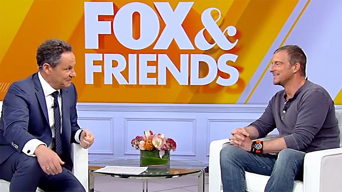 Brian Kilmeade and Bear Grylls on the set of Fox & Friends