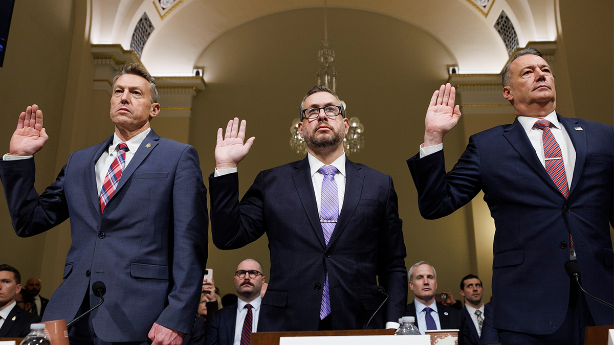 Rodney Scott, Joseph Edlow, and Todd Lyons standing and being sworn in at a House Committee hearing in Washington