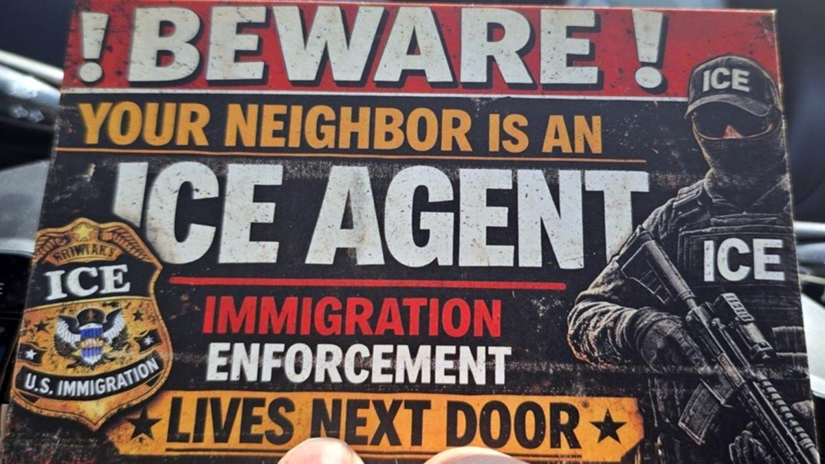 ICE agent standing in front of a building