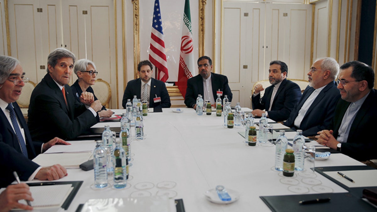 U.S. Secretary of Energy Ernest Moniz, U.S. Secretary of State John Kerry and U.S. Under Secretary for Political Affairs Wendy Sherman (L-3rd L) meet with Iranian Foreign Minister Mohammad Javad Zarif (2nd R) at a hotel in Vienna, Austria June 28, 2015.