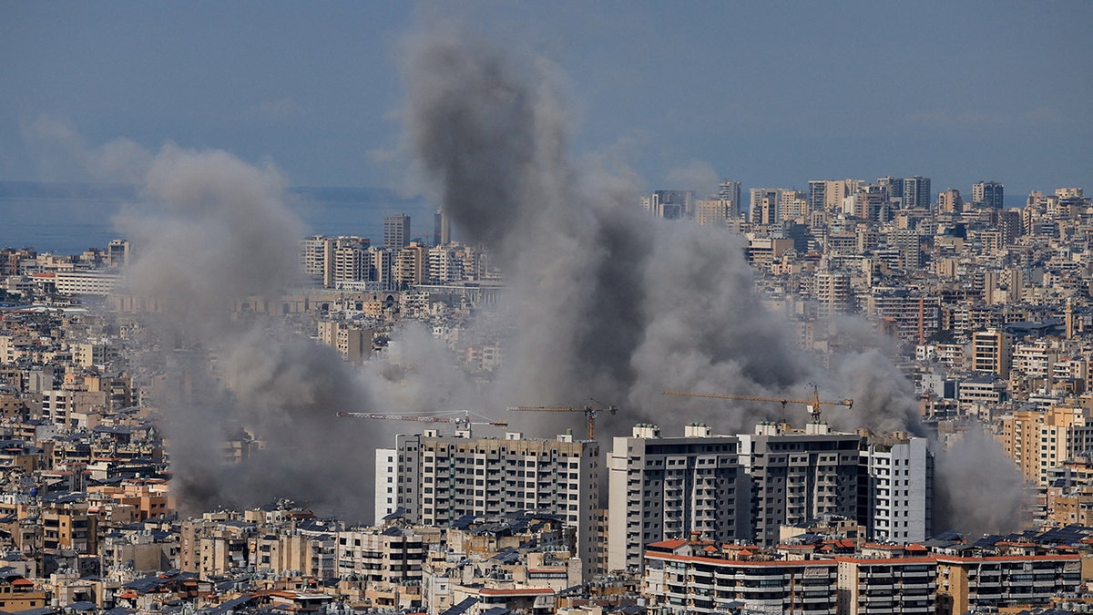 Smoke billows over Beirut's southern suburbs as seen from Baabda Lebanon