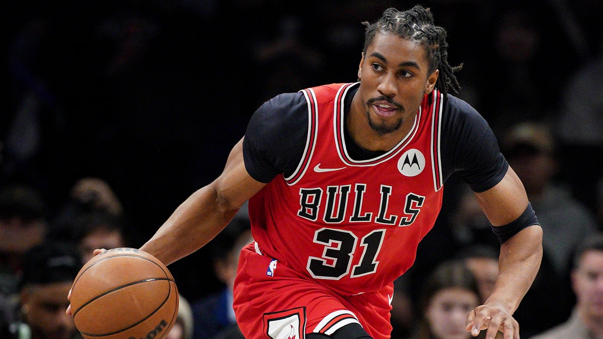 Jaden Ivey dribbling a basketball during a game at Barclays Center