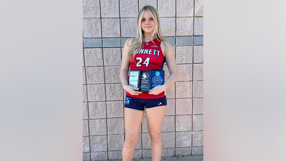Jaylyn Fehr, Horizon Christian Academy volleyball player, poses with awards