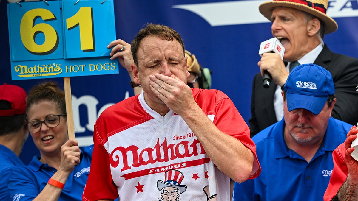 Joey Chestnut eating hot dogs during a contest at Coney Island