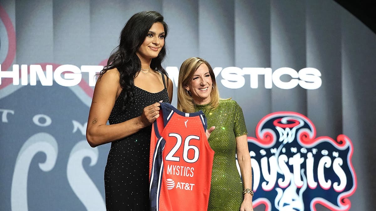 Lauren Betts poses with WNBA Commissioner Cathy Engelbert after being selected by Washington Mystics.