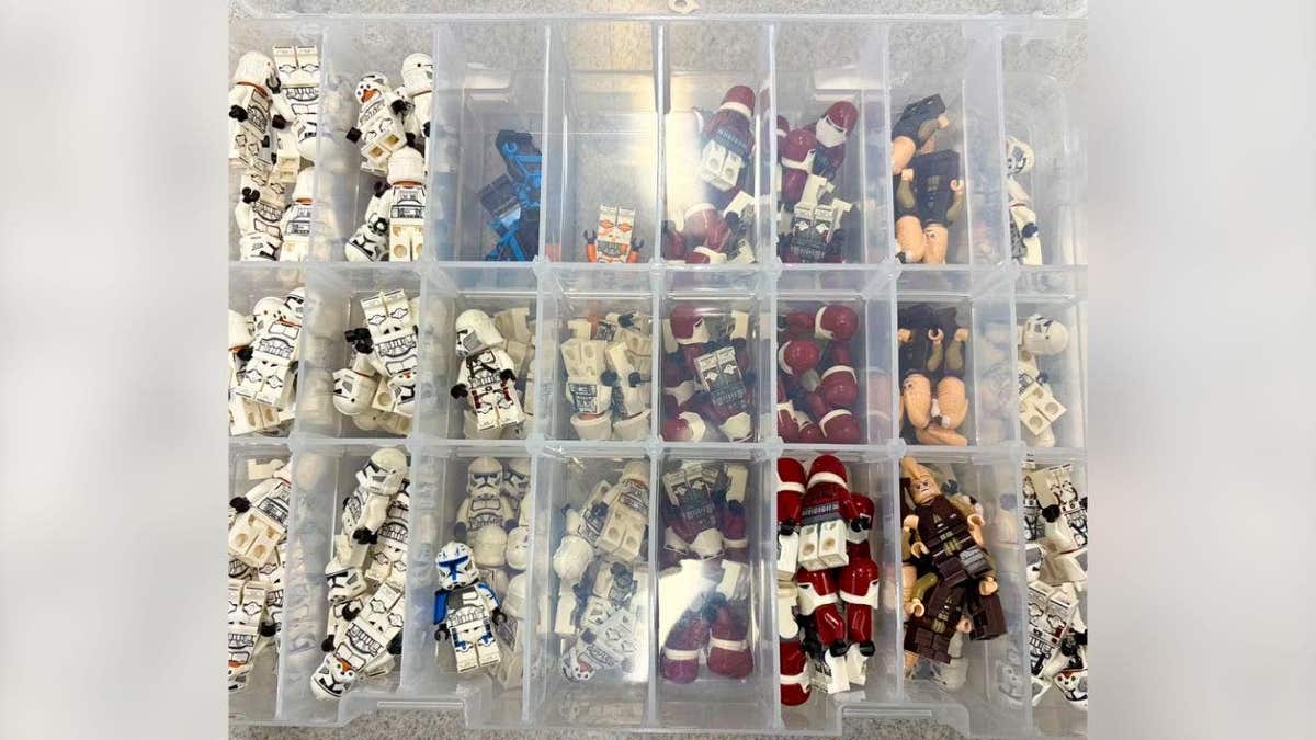 rganized Lego minifigures displayed in compartments as evidence