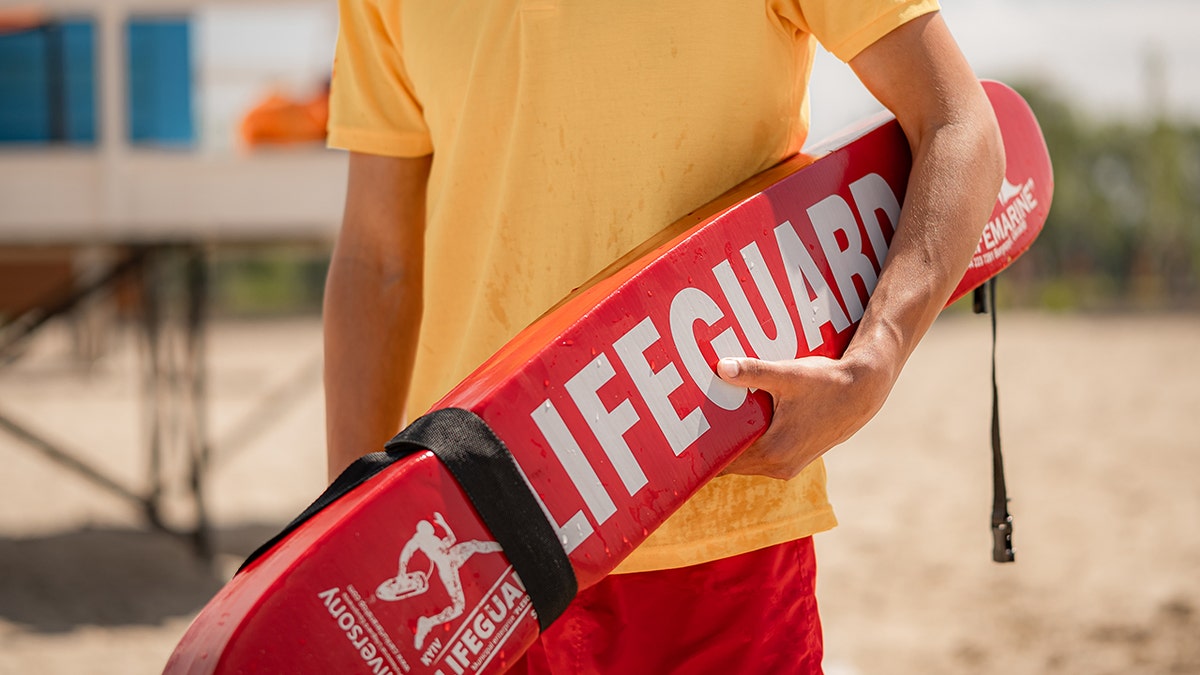Lifeguard standing watch on a beach in Los Angeles
