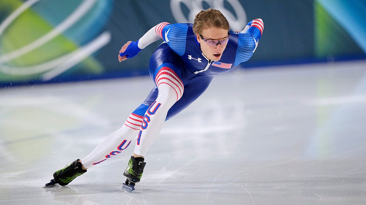 Jordan Stolz warming up on ice rink for men's 1,000 meters speedskating race