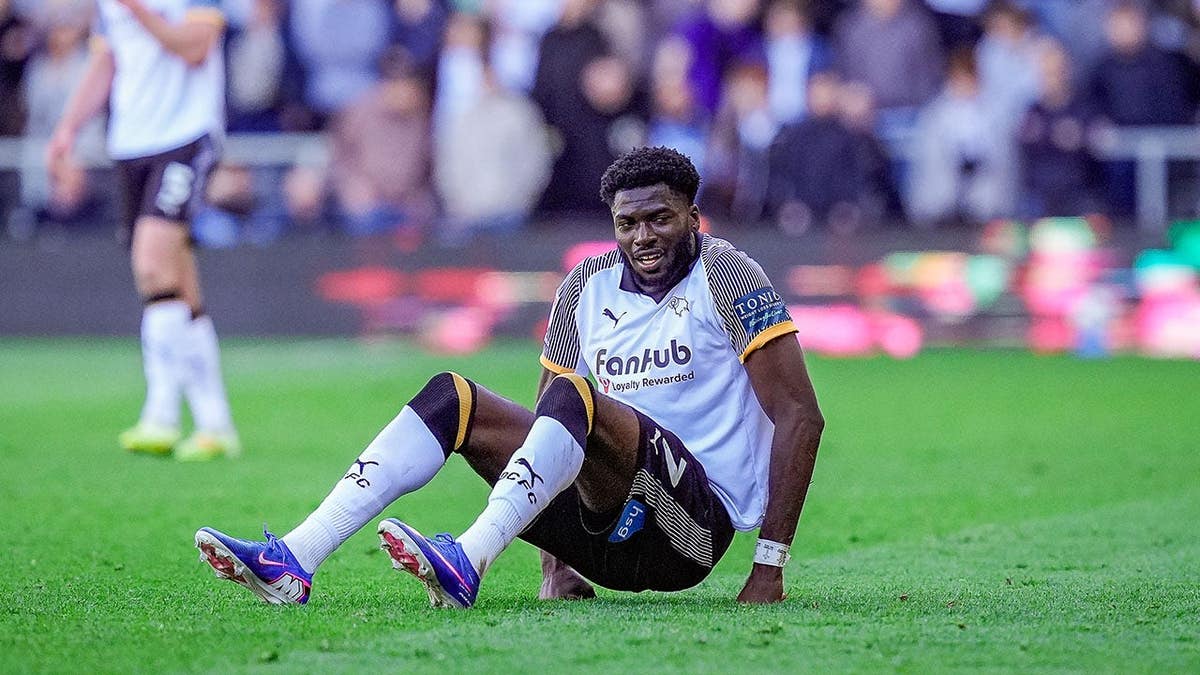 Patrick Agyemang of Derby County falling on the pitch during a soccer match.