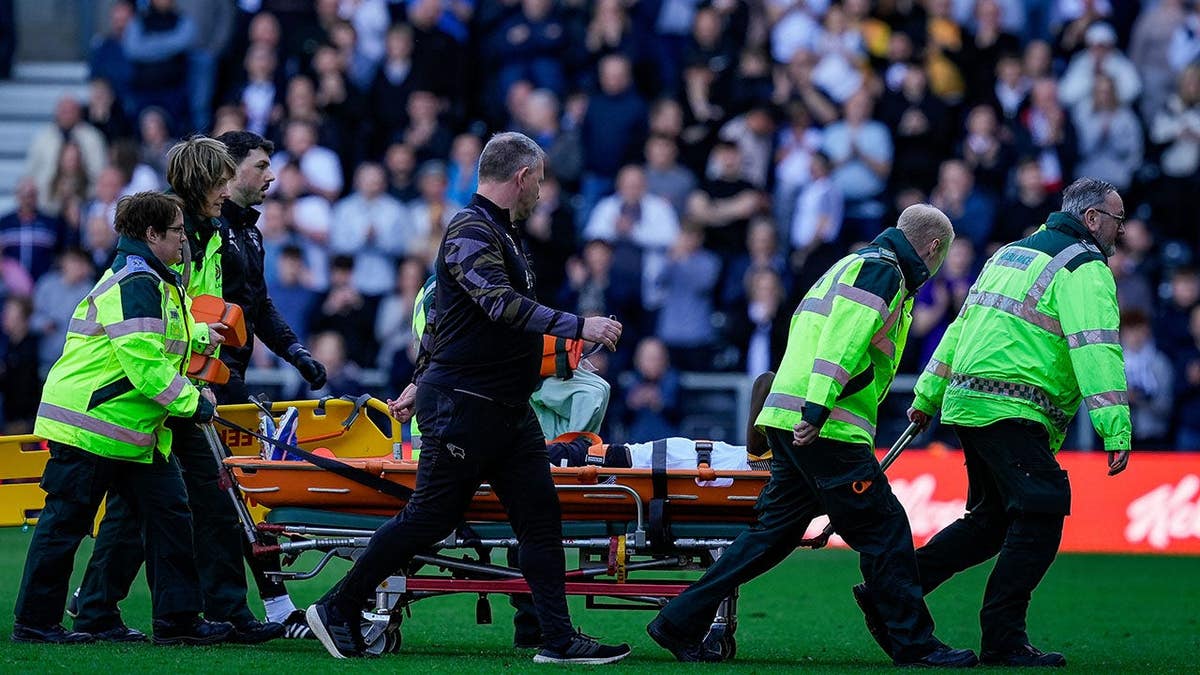 Patrick Agyemang of Derby County being stretchered off the field at Pride Park Stadium