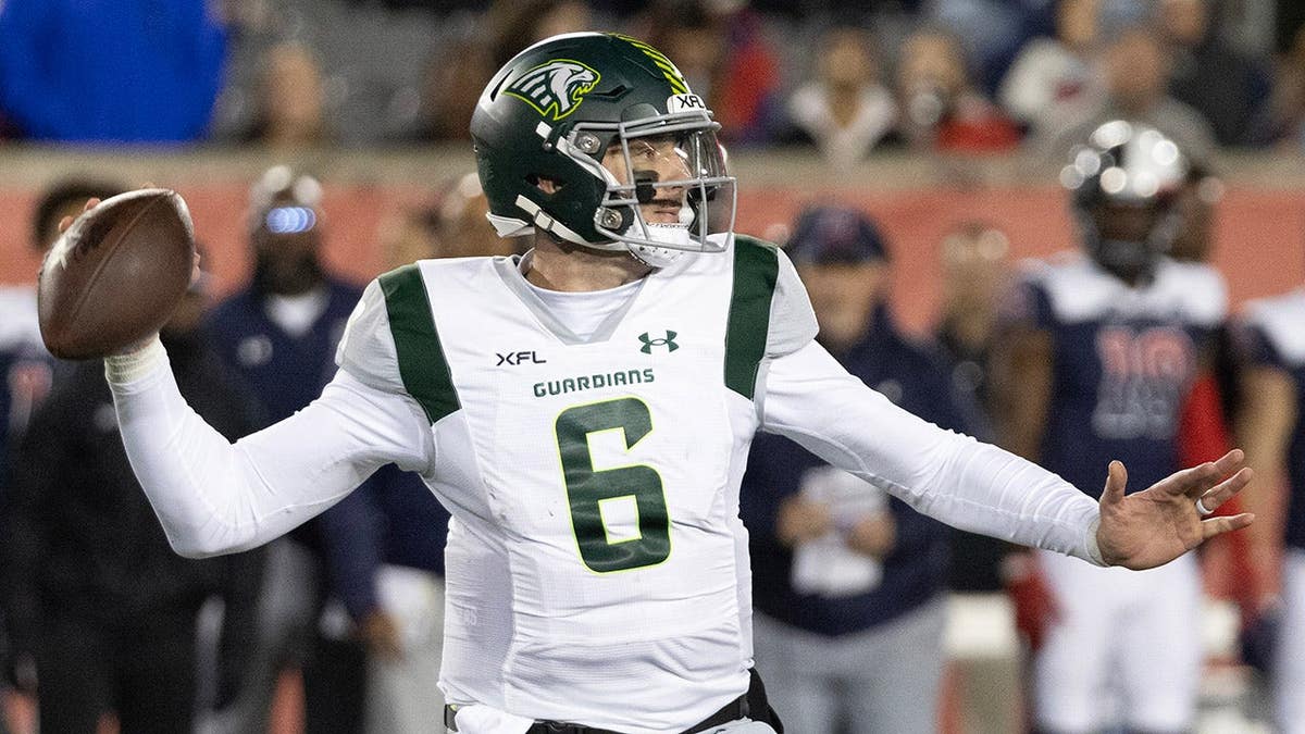 Orlando Guardians quarterback Paxton Lynch drops back to pass at TDECU Stadium