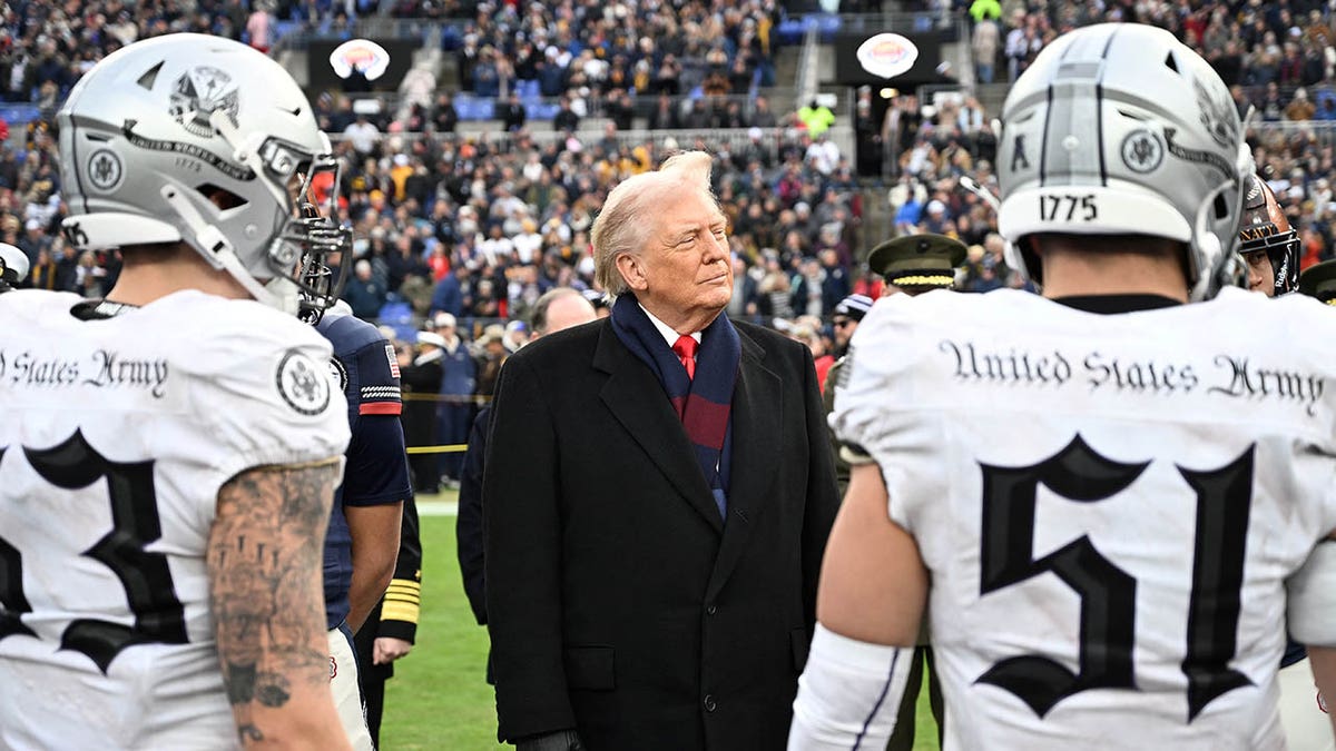 President Donald Trump looking on before a college football game at M&T Bank Stadium
