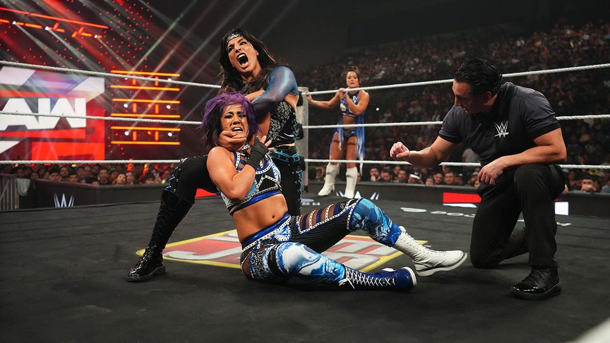 Raquel Rodriguez wrestling Bayley in a WWE match at Sames Auto Arena