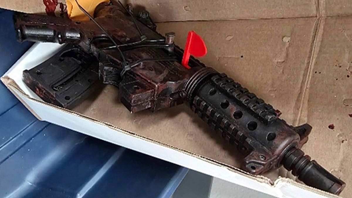 rifle on top of cardboard