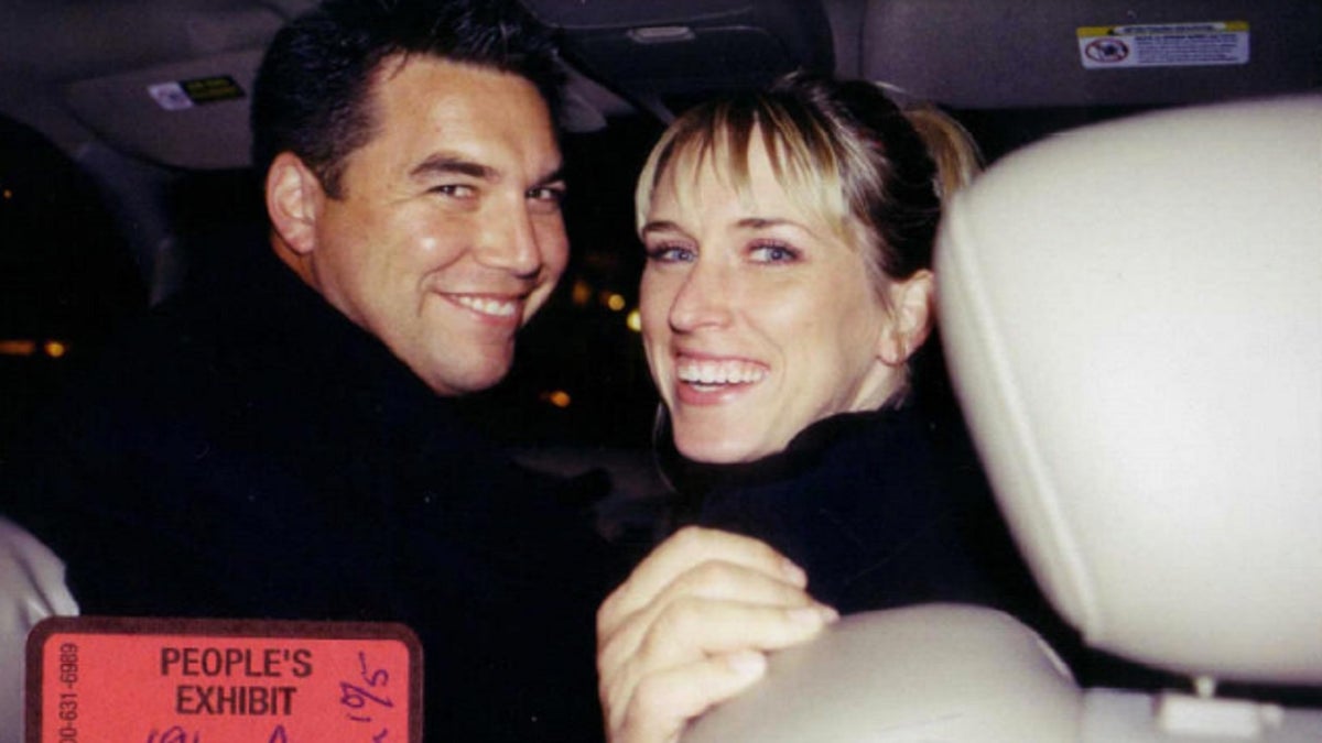 Scott Peterson and Amber Frey smiling together in a photo.