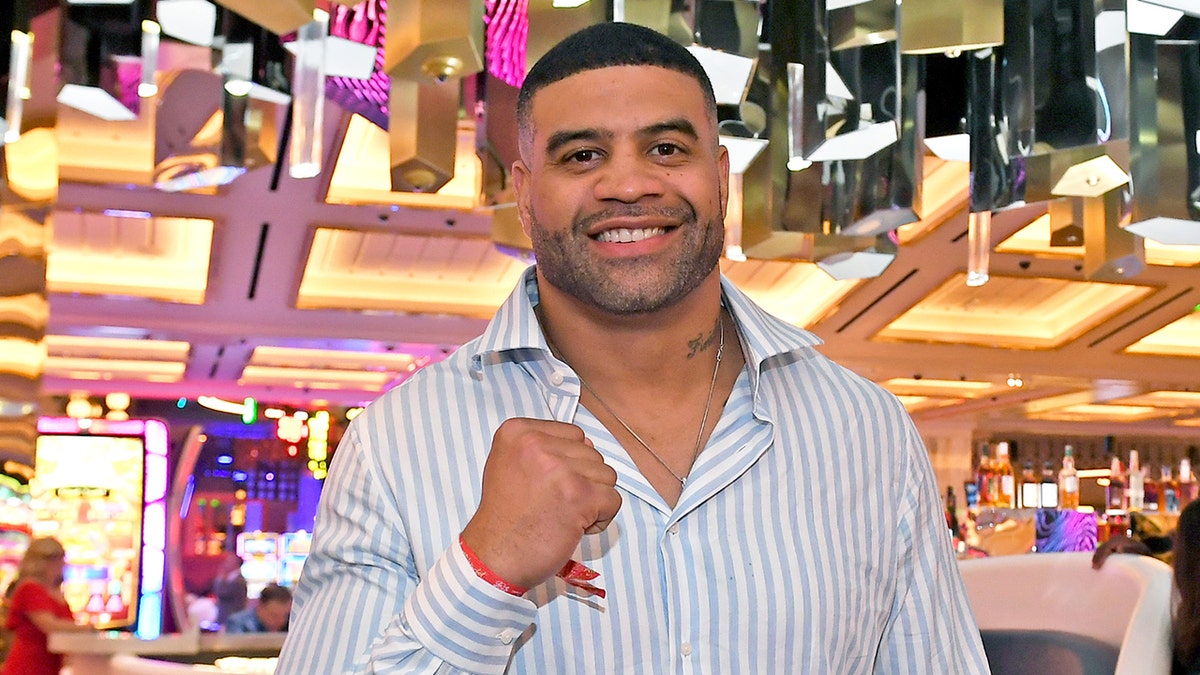 Shawne Merriman posing with fist up at Resorts World Las Vegas grand opening