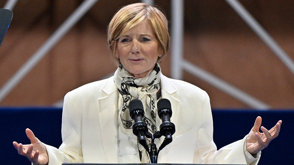 Rep. Susie Lee talks into a microphone