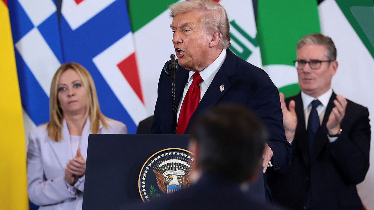 U.S. President Donald Trump delivering remarks with Italian Prime Minister Giorgia Meloni and British Prime Minister Keir Starmer applauding