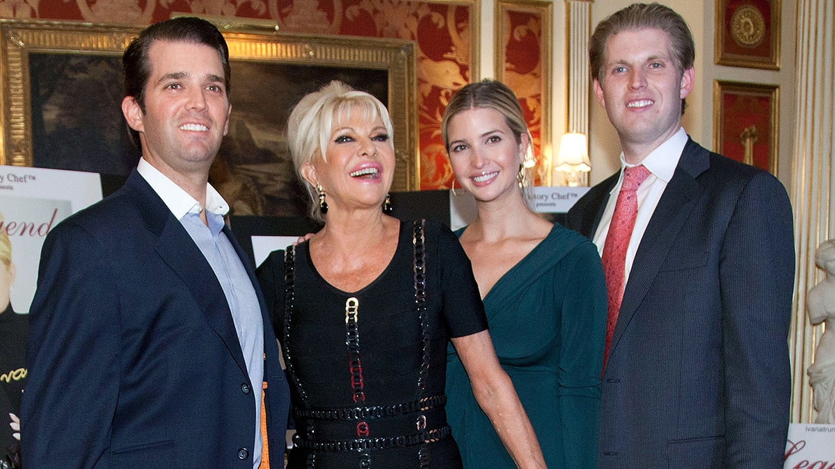 Donald Trump Jr., Ivana Trump, Ivanka Trump, and Eric Trump standing together at an event