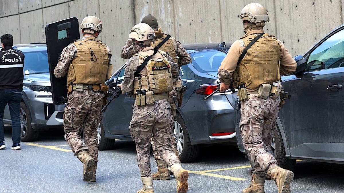 Turkish Police special forces walking near the Israeli consulate building in Istanbul