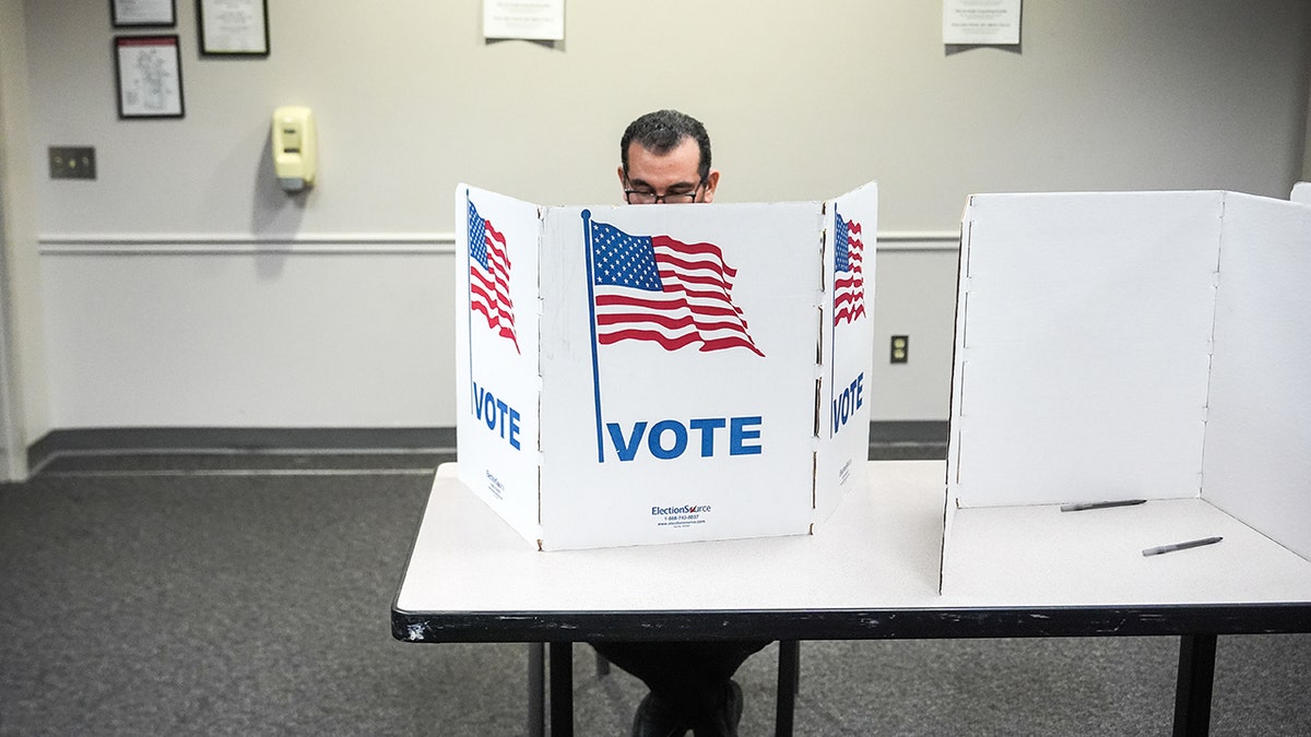 A person voting at Fairfax Government Center in Virginia.