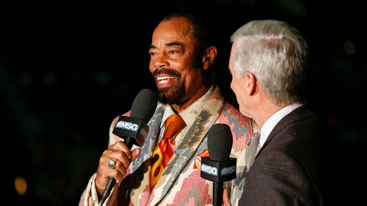 Walt Frazier broadcasting before a basketball game at Philips Arena in Atlanta