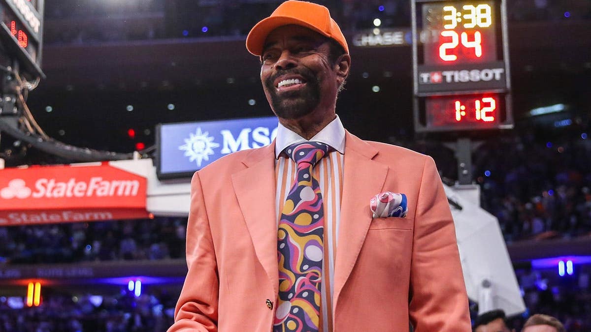 Walt Frazier standing on the basketball court at Madison Square Garden