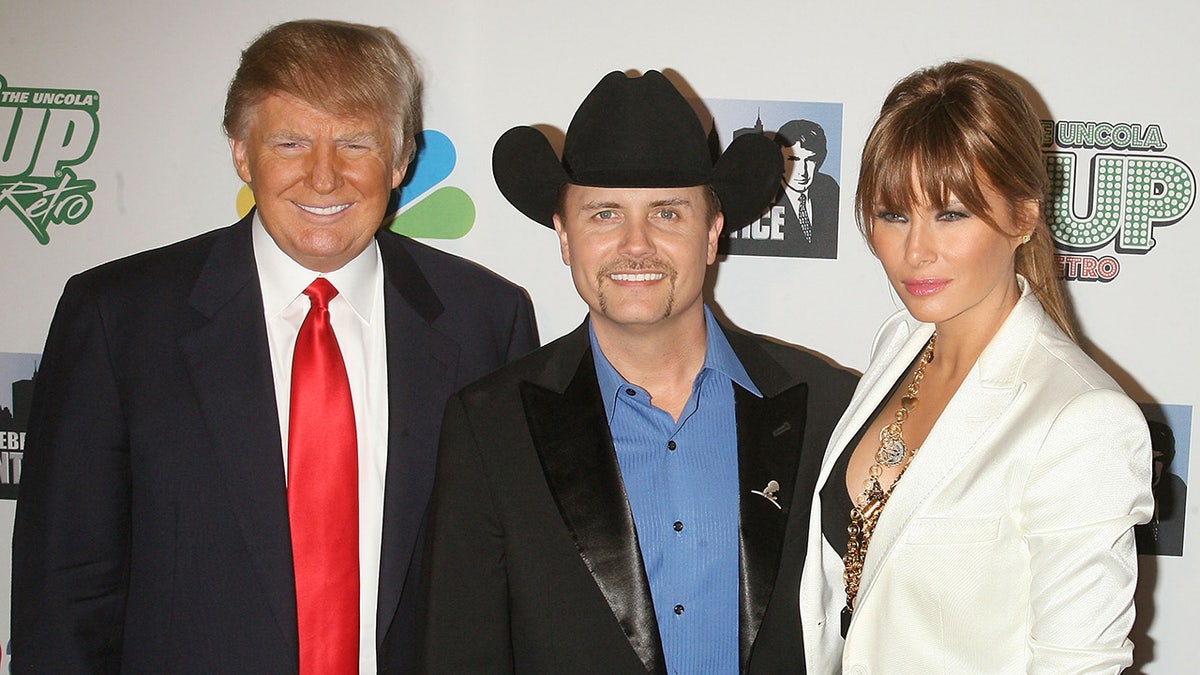 Donald Trump, John Rich and Melania Trump standing together at an event