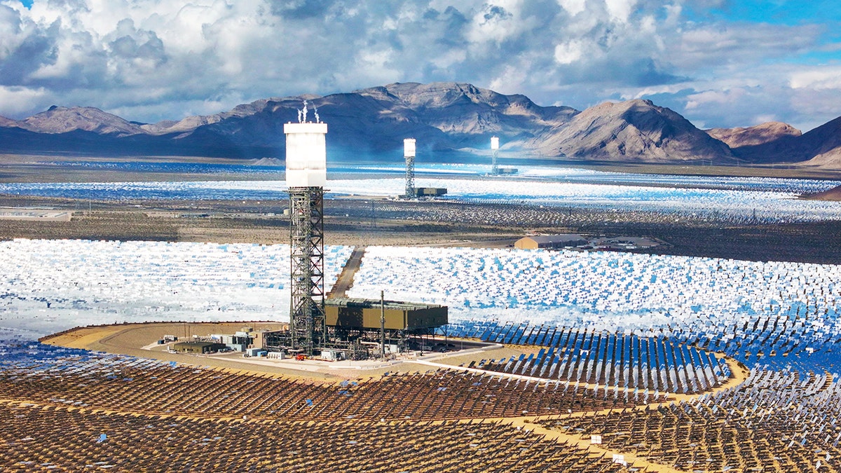 Ivanpah Solar Power Plant towers with mirrors reflecting sunlight in Mojave Desert